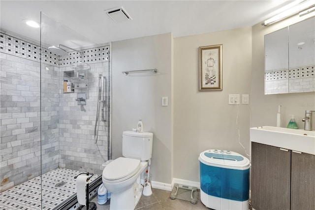 bathroom featuring walk in shower, vanity, toilet, and tile floors