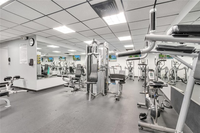 workout area featuring a paneled ceiling