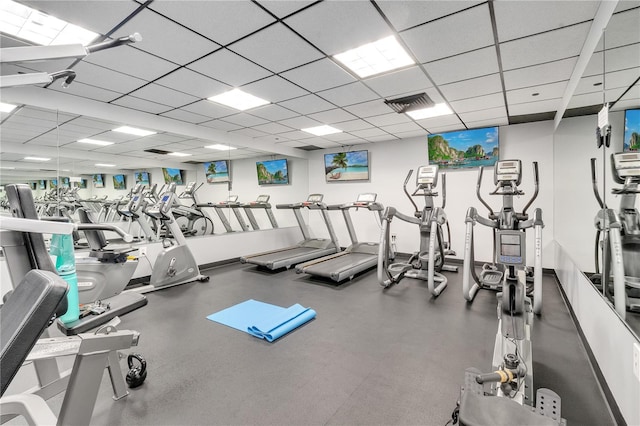 workout area featuring a drop ceiling