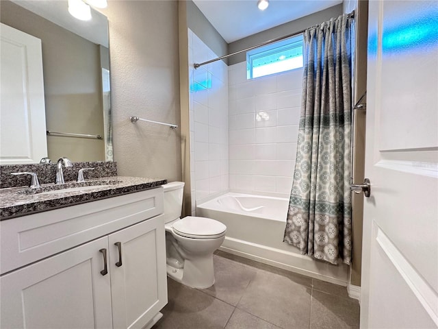 bathroom featuring toilet, shower / bathtub combination with curtain, vanity, and tile patterned floors