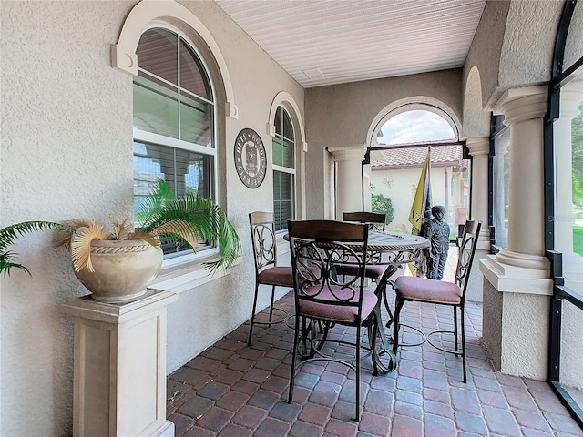 sunroom featuring ornate columns