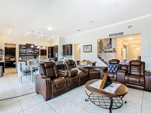 tiled living room with ornamental molding and an inviting chandelier