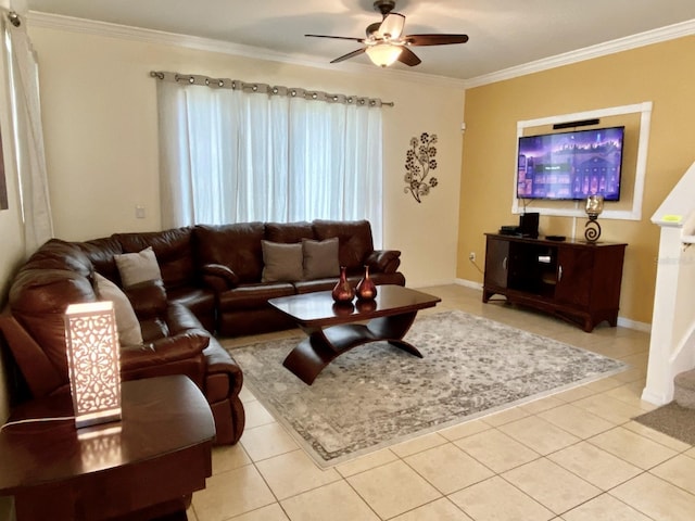 living room with ornamental molding, ceiling fan, and light tile floors