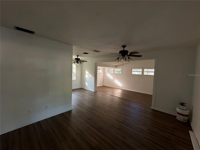 interior space featuring ceiling fan and dark hardwood / wood-style floors