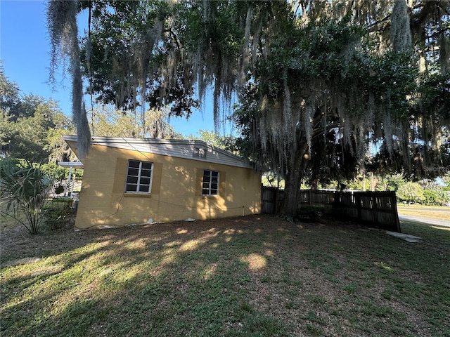 back of house featuring a yard