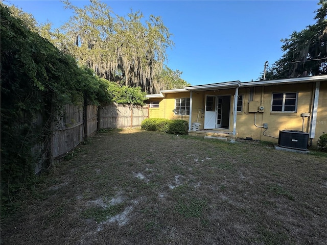 view of yard with central AC unit