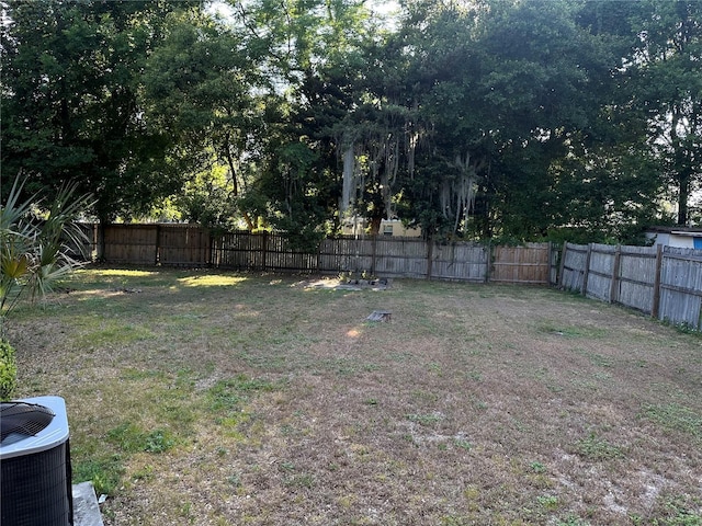 view of yard with central air condition unit