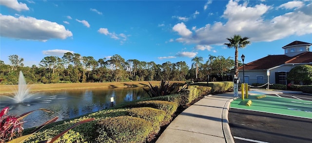 surrounding community featuring a water view