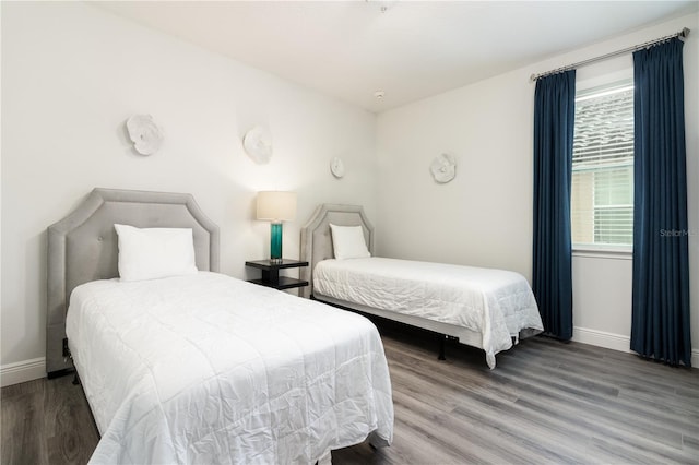 bedroom with wood-type flooring