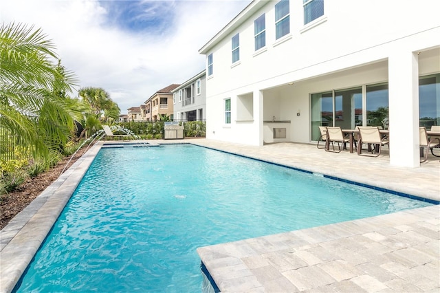 view of swimming pool featuring a patio area and a fenced in pool