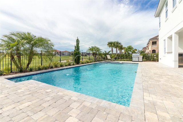 view of swimming pool featuring a fenced in pool, fence, and a patio