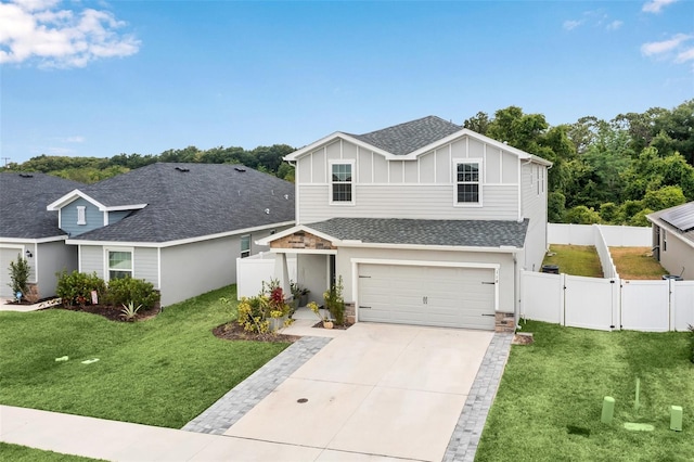 view of front facade with a garage and a front yard