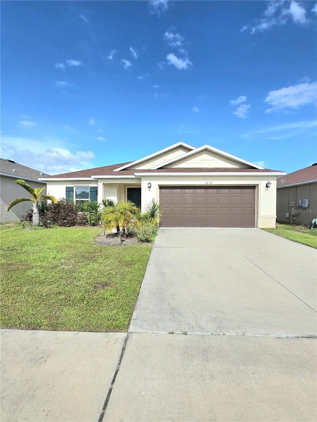 ranch-style home featuring a front yard and a garage