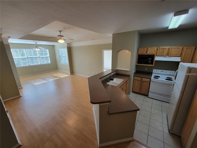 kitchen with light brown cabinets, white appliances, sink, ceiling fan, and light tile patterned floors