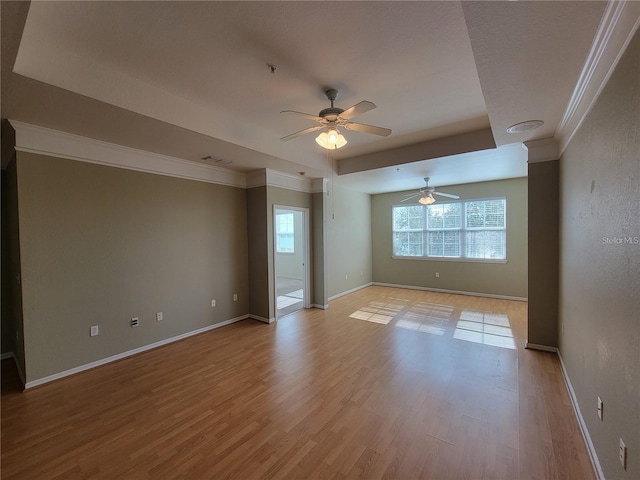 spare room with ceiling fan and light wood-type flooring