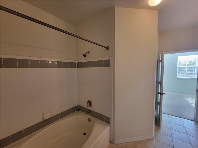 bathroom featuring tile patterned flooring and shower / washtub combination