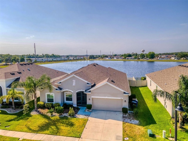 view of front of house featuring a front yard and a water view