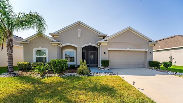 view of front of home featuring a front lawn and a garage