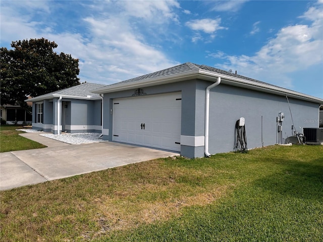 view of home's exterior with a garage, a yard, and central air condition unit