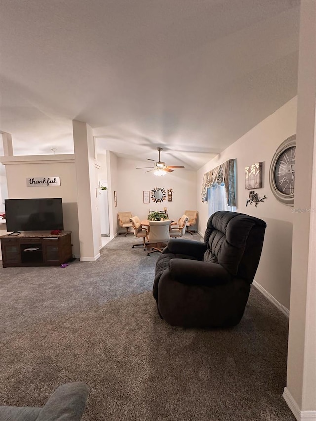 living room with carpet and ceiling fan