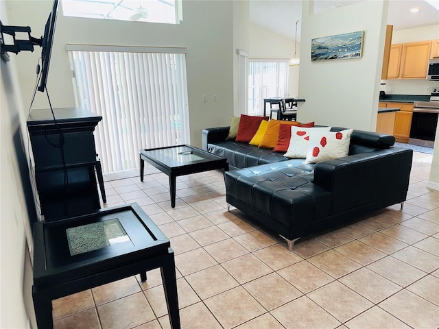 tiled living room with high vaulted ceiling