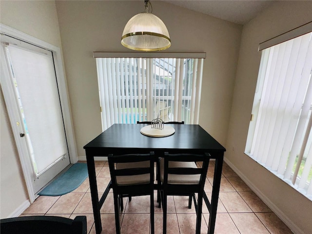 dining area with light tile patterned floors