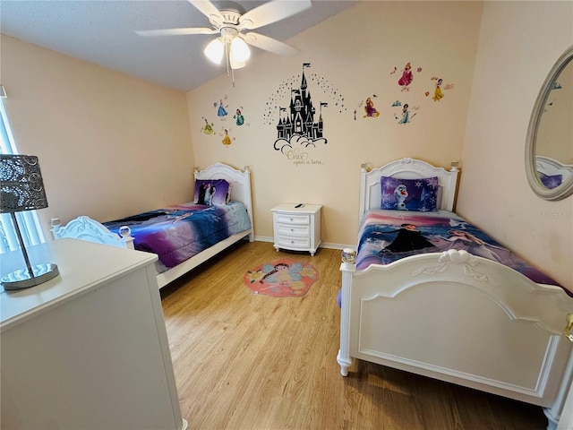 bedroom with wood-type flooring and ceiling fan