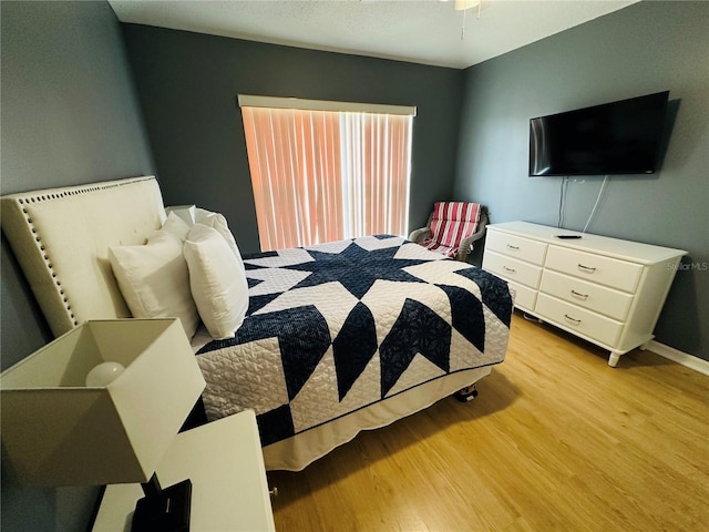 bedroom with light hardwood / wood-style floors