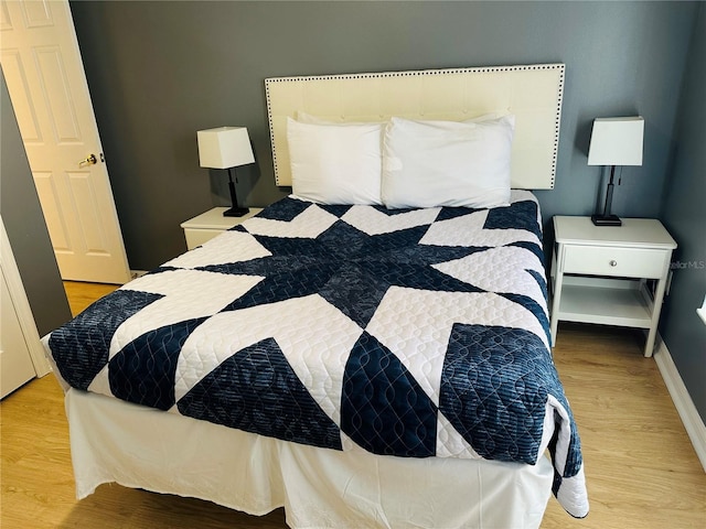 bedroom with light hardwood / wood-style floors