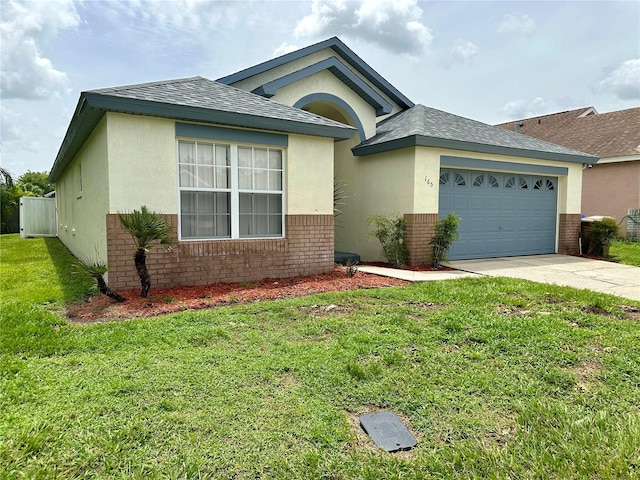 view of front of home with a garage and a front yard