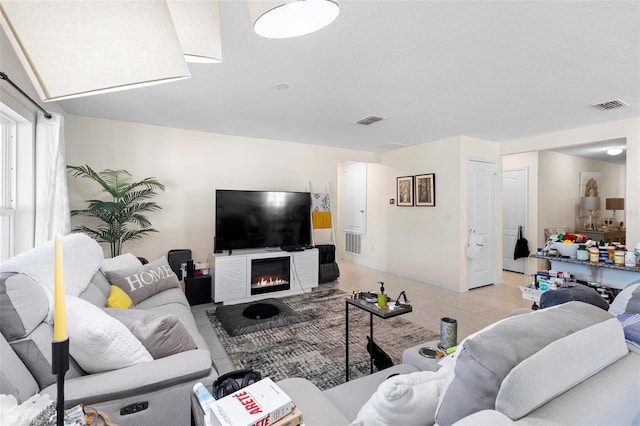 living room featuring light tile floors