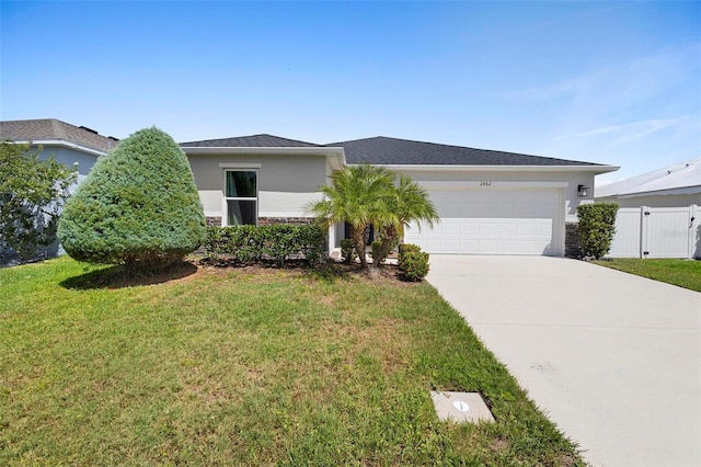 single story home featuring a front yard and a garage