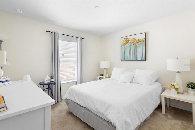 bedroom featuring light colored carpet