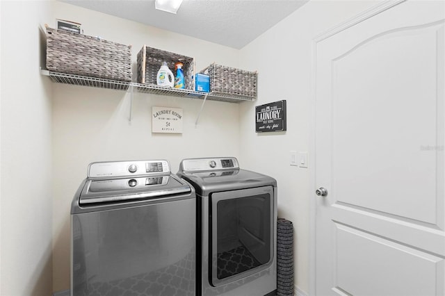 washroom featuring washer and clothes dryer