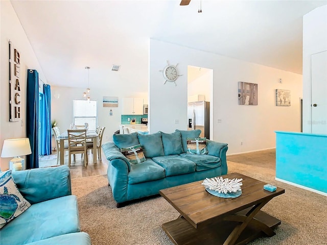 living room featuring carpet floors and ceiling fan