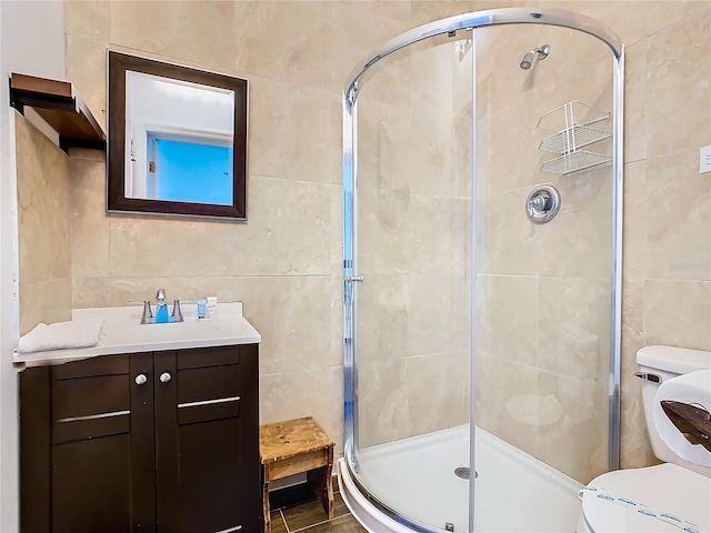 bathroom featuring tile walls and an enclosed shower