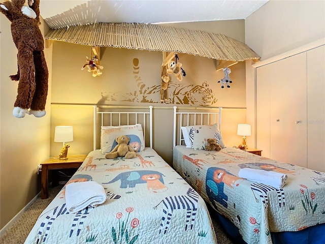 carpeted bedroom featuring a closet