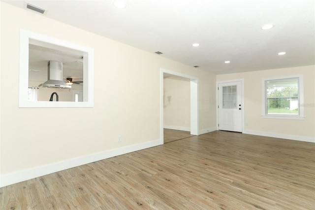 spare room with light hardwood / wood-style flooring