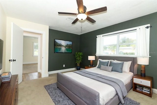 bedroom with ceiling fan and light wood-type flooring