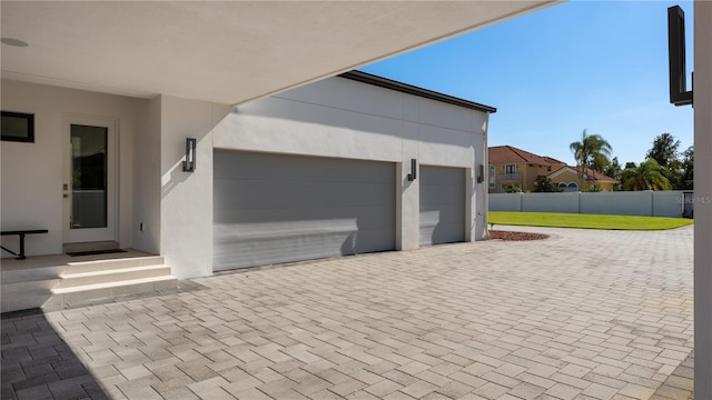 garage with a lawn