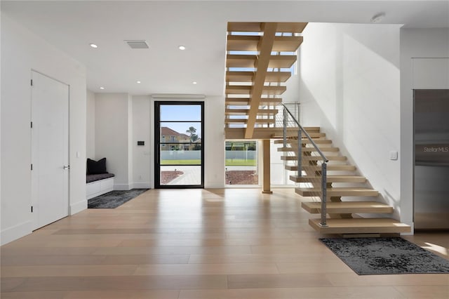 entryway with light hardwood / wood-style flooring