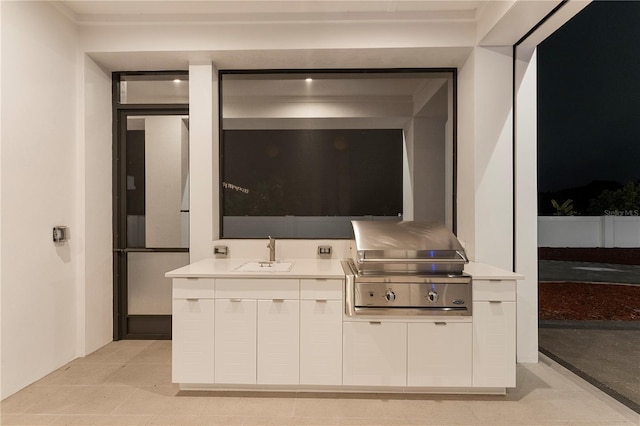 view of patio featuring a grill, sink, and an outdoor kitchen