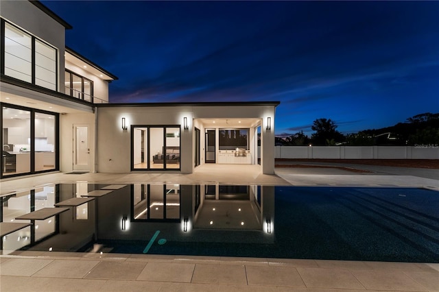 view of pool at night