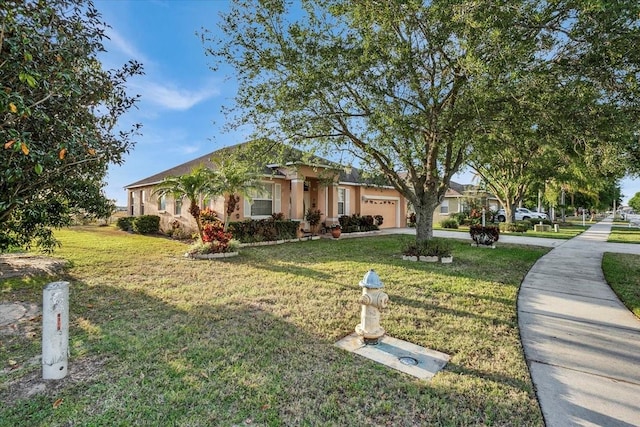 ranch-style house with a front yard and a garage