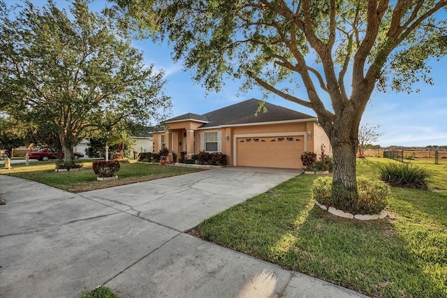 ranch-style house with a garage and a front lawn