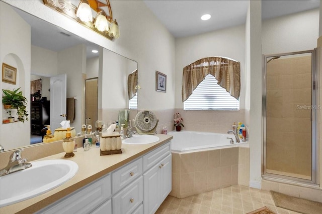 bathroom featuring tile floors, separate shower and tub, and double sink vanity