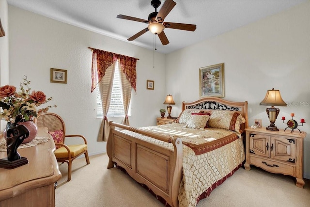 bedroom featuring ceiling fan and light colored carpet