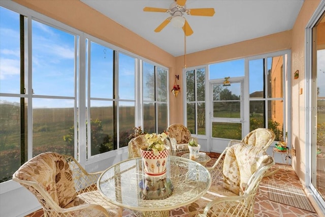 sunroom featuring ceiling fan