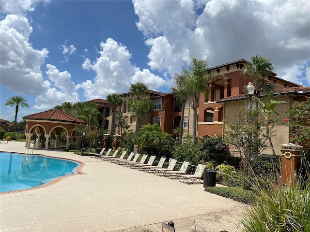 view of pool featuring a gazebo and a patio