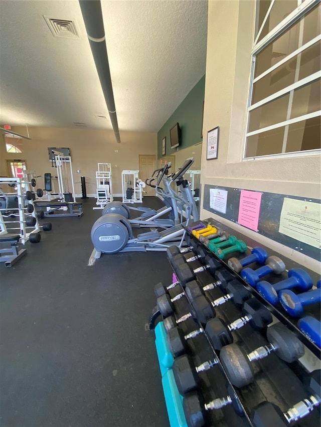 workout area with a textured ceiling